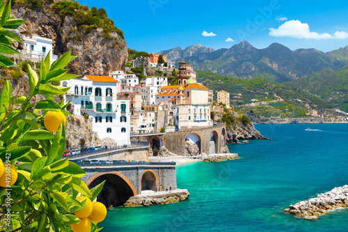 Fototapeta Beautiful view of Amalfi on the Mediterranean coast with lemons in the foregroun