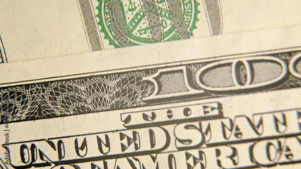 Macro video. Close-up of isolated dollar bills being laid on the table. Portraits of George Washington and Benjamin Franklin. 1 dollar and 100 dollar banknotes. Cash withdrawal. Money and finance Macro video. Close-up of isolated dollar bills being laid on the table. Portraits of George Washington and Benjamin Franklin. 1 dollar and 100 dollar banknotes. Cash withdrawal. Money and finance
