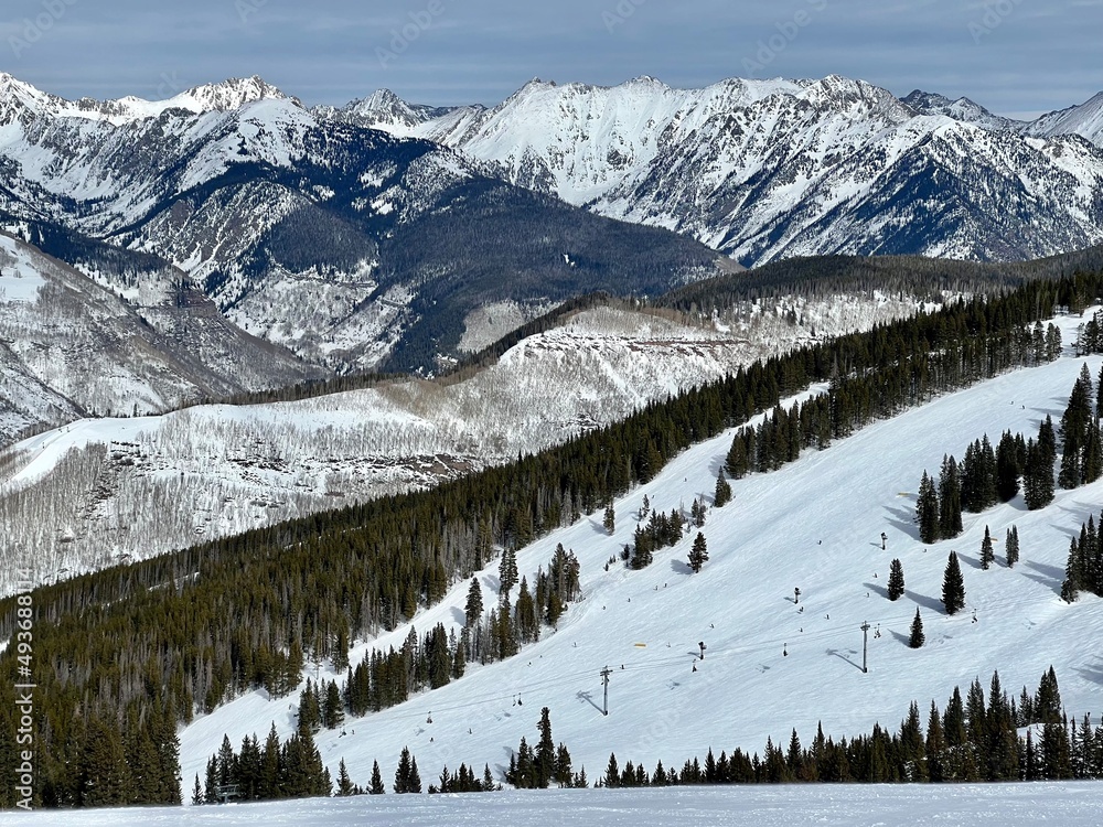 Landscape view of snowy mountains and forest of Vail Ski Resort, Colorado.