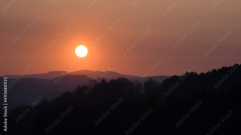 Orange sunset over landscape background Orange sunset over landscape background
