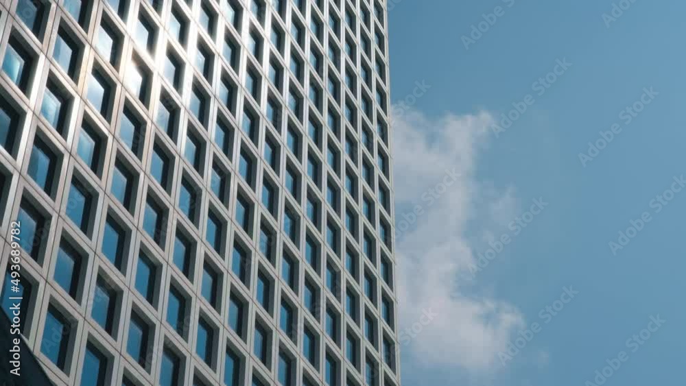 Clouds passing the downtown office building in the downtown city area. Timelapse. Clouds passing the downtown office building in the downtown city area. Timelapse.