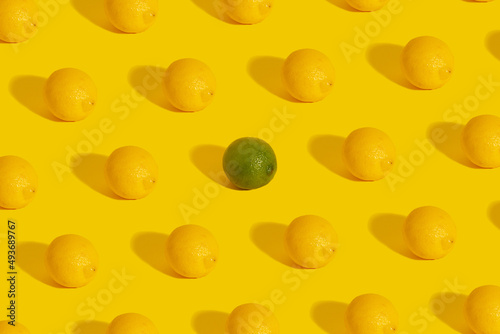 Pattern of lemon on a yellow background with green lime in the middle.