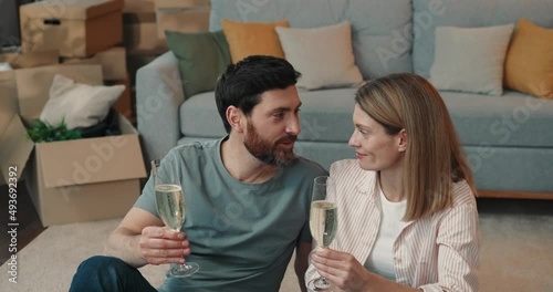 Portrait of  caucasian  loving couple clinking glasses  with champagne during romantic date at home  photo