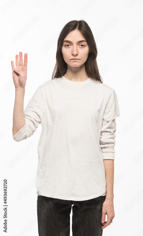 half-length portrait of a young Ukrainian girl who shows the number with her hands on a white background
half-length portrait of a young Ukrainian girl who shows the number with her hands on a white background