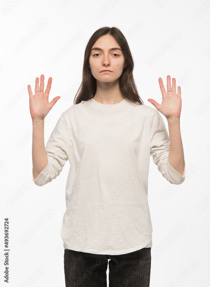 half-length portrait of a young Ukrainian girl who shows the number with her hands on a white background
half-length portrait of a young Ukrainian girl who shows the number with her hands on a white background