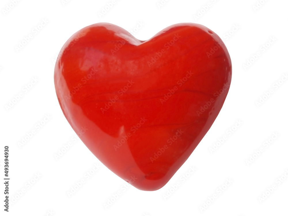 Beautiful red tumbled heart. Formed by nature into a heart shape, made of a semi-precious stone mineral. The heart element is polished, the object is on a white background.