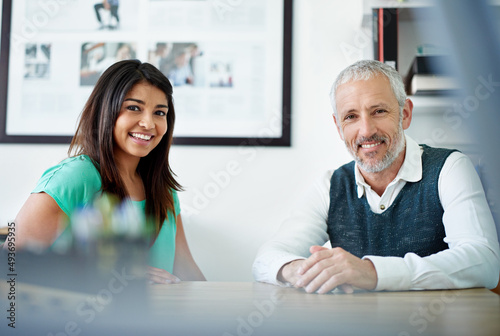 Theyll take care of all your design needs. Portrait of two designers in their office.