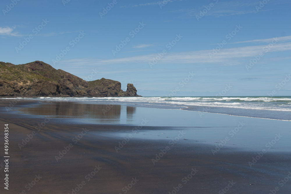 Bethells beach in a sunny day, New Zealand.