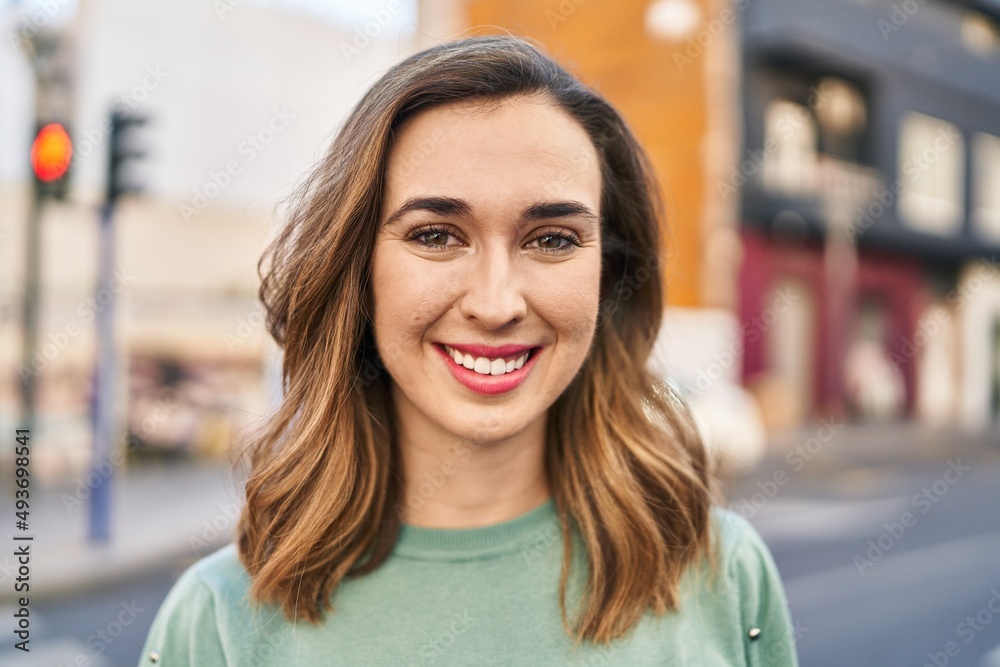 Young woman smiling confident standing at street Young woman smiling confident standing at street