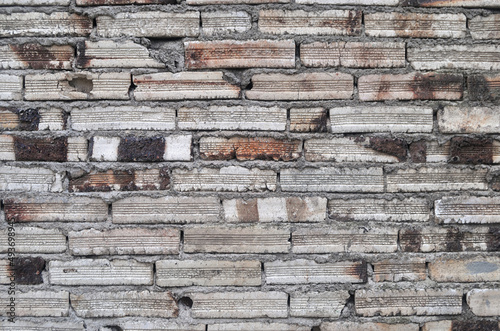 Textura de pequenos tijolos velhos de cor branca, muro antigo 
