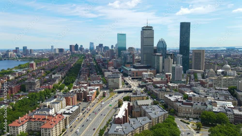 Boston Back Bay modern city skyline including John Hancock Tower, Prudential Tower, and Four Season Hotel at One Dalton Street in Boston, Massachusetts MA, USA.  