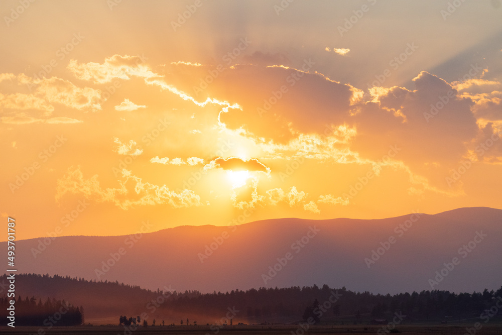 Golden sunset in the mountains, Warm sunset background