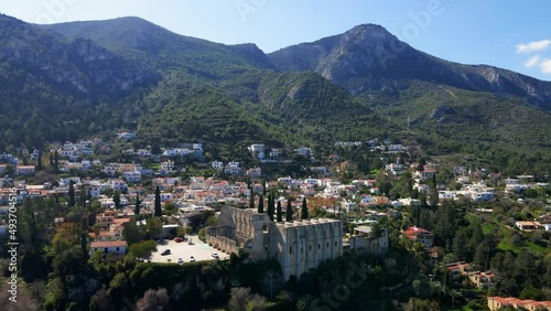 Wallpaper Mural Aerial 4K view of beautiful Bellapais Village with Bellapais Monastery in Kyrenia, North Cyprus surrounded with an amazing green Mediterranean nature and picturesque landscapes in Cyprus. Torontodigital.ca