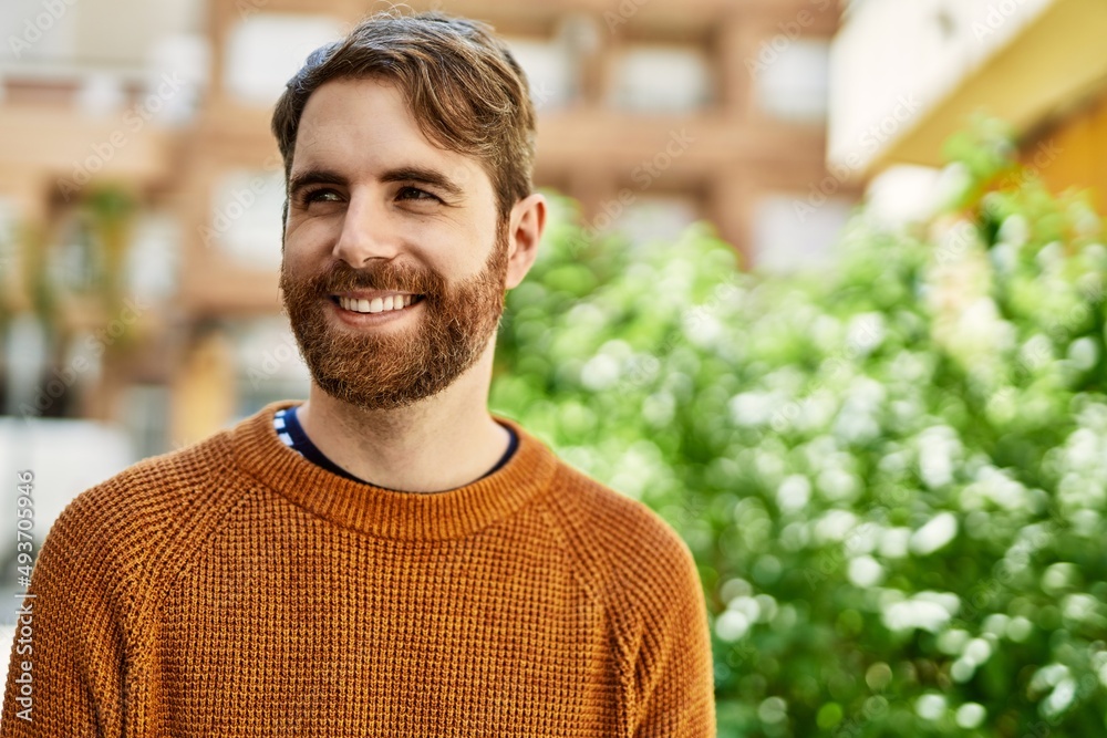 Young caucasian man with beard outdoors on a sunny day Young caucasian man with beard outdoors on a sunny day