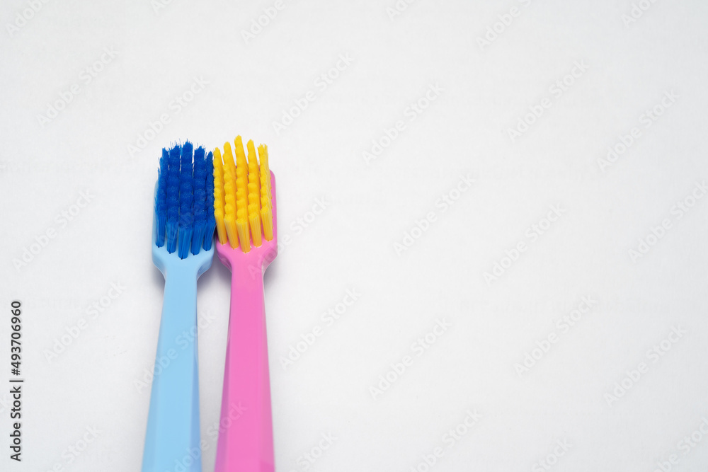 A conceptual of a couple toothbrush in love. Toothbrushes convey the human relationship between a man and a woman. A conceptual of a couple toothbrush in love. Toothbrushes convey the human relationship between a man and a woman.