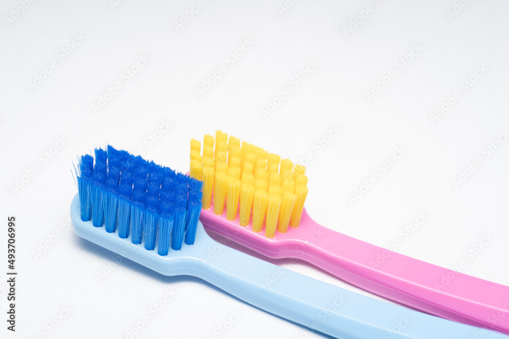 A conceptual of a couple toothbrush in love. Toothbrushes convey the human relationship between a man and a woman. A conceptual of a couple toothbrush in love. Toothbrushes convey the human relationship between a man and a woman.