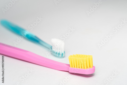 2 different toothbrush. Toothbrush closeup on white background.