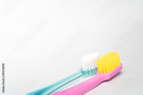 2 different toothbrush. Toothbrush closeup on white background.
