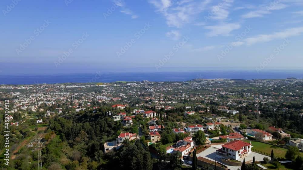 Aerial 4K view of beautiful Bellapais Village with Bellapais Monastery in Kyrenia, North Cyprus surrounded with an amazing green Mediterranean nature and picturesque landscapes in Cyprus. Aerial 4K view of beautiful Bellapais Village with Bellapais Monastery in Kyrenia, North Cyprus surrounded with an amazing green Mediterranean nature and picturesque landscapes in Cyprus.