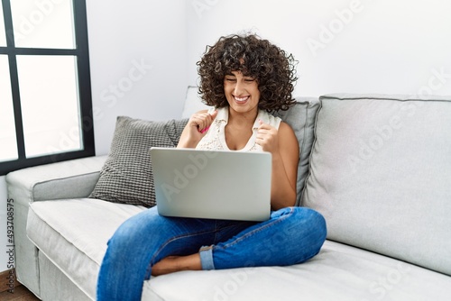 Young middle east woman smiling confident having video call at home