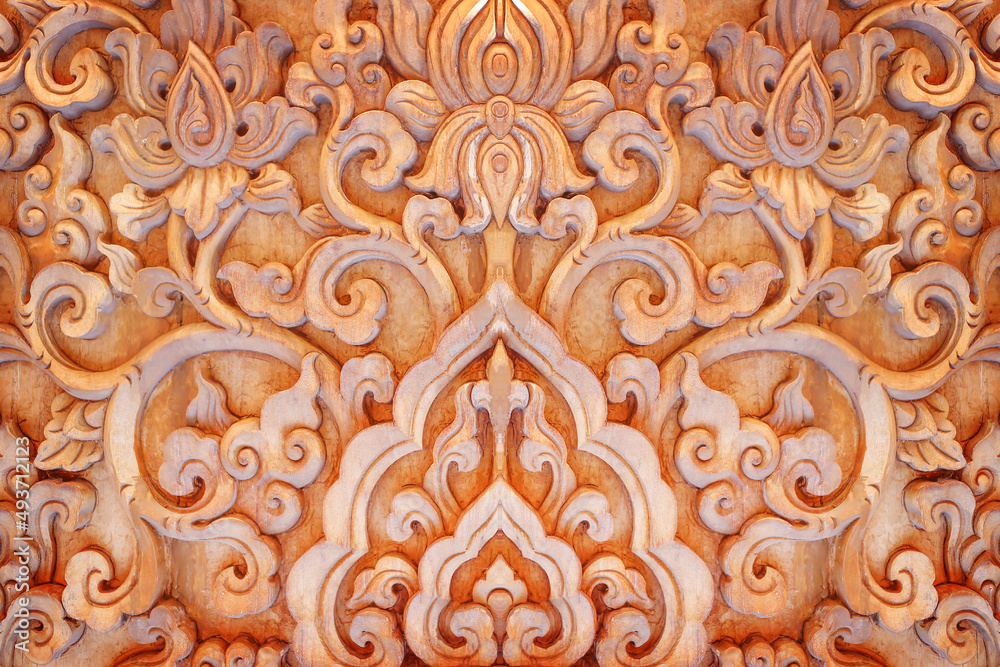 Pattern of flower carved thai style on wood background
