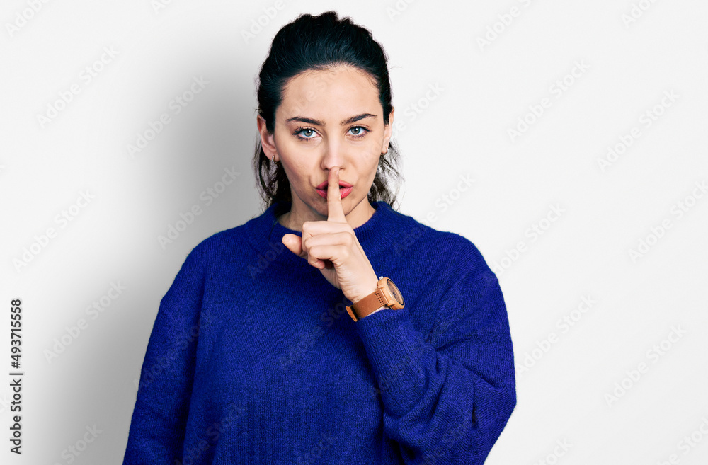 Young hispanic woman wearing casual clothes asking to be quiet with finger on lips. silence and secret concept. Young hispanic woman wearing casual clothes asking to be quiet with finger on lips. silence and secret concept.
