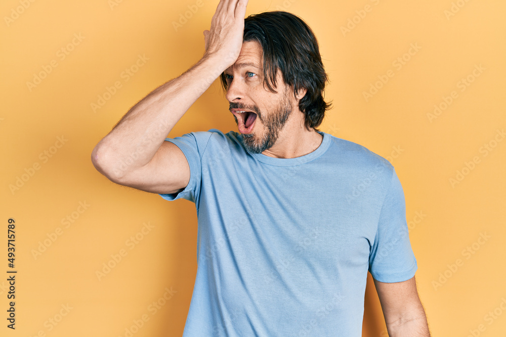 Middle age caucasian man wearing casual clothes surprised with hand on head for mistake, remember error. forgot, bad memory concept. Middle age caucasian man wearing casual clothes surprised with hand on head for mistake, remember error. forgot, bad memory concept.