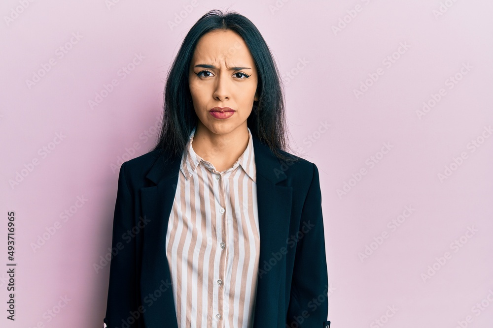 Young hispanic girl wearing business clothes depressed and worry for distress, crying angry and afraid. sad expression. Young hispanic girl wearing business clothes depressed and worry for distress, crying angry and afraid. sad expression.