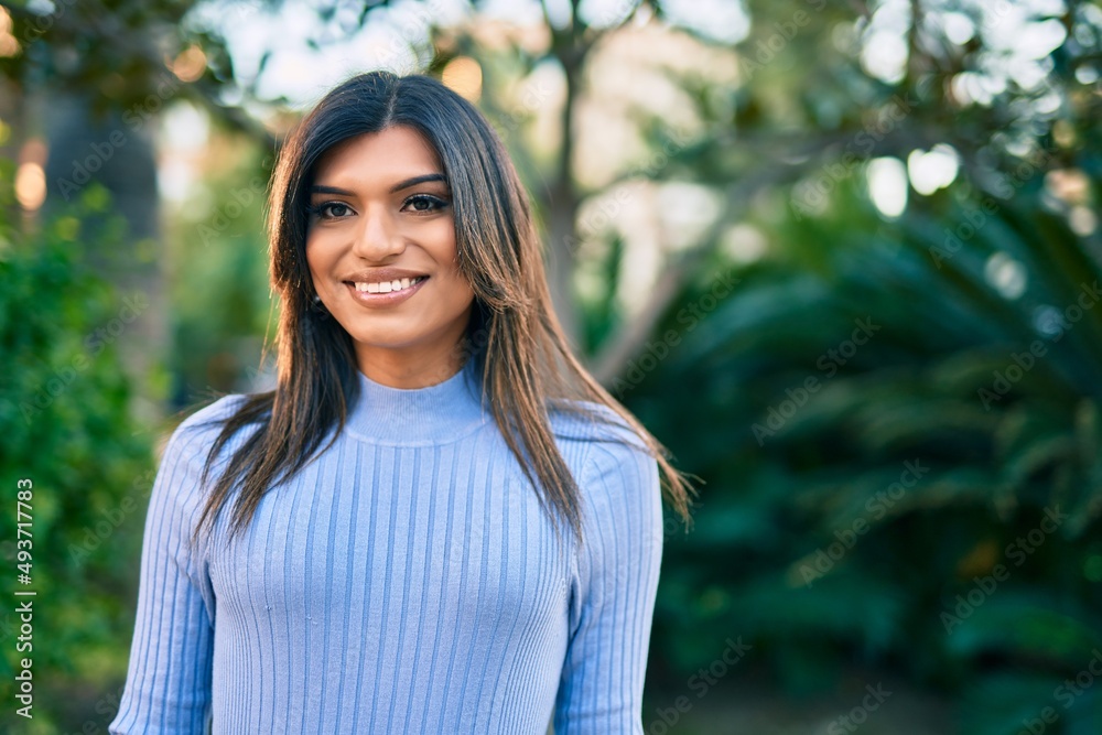 Beautiful hispanic woman smiling confient at the park Beautiful hispanic woman smiling confient at the park