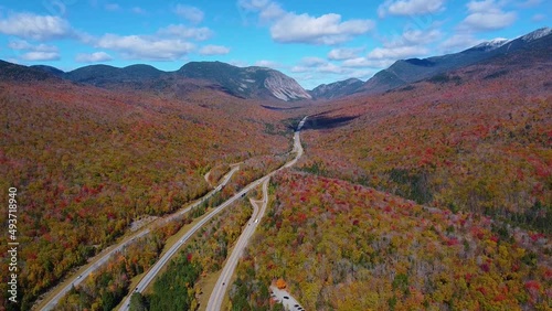 Franconia Notch State Park and Interstate Highway I-93 aerial view facing Franconia Notch in White Mountain National Forest with fall foliage, Town of Lincoln, New Hampshire NH, USA. photo
