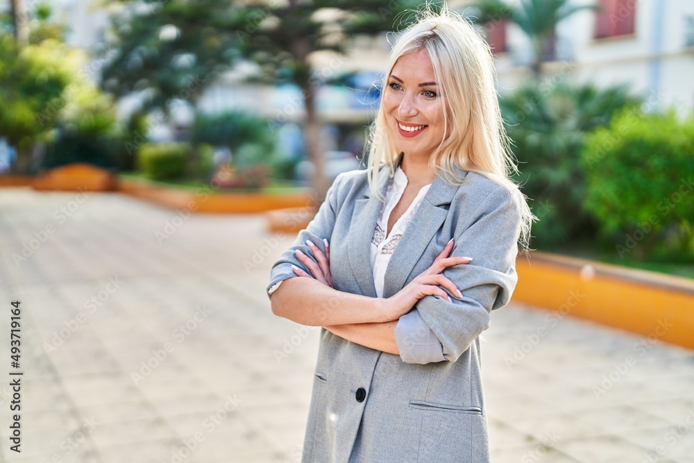 Young blonde woman smiling confident standing with arms crossed gesture at park Young blonde woman smiling confident standing with arms crossed gesture at park