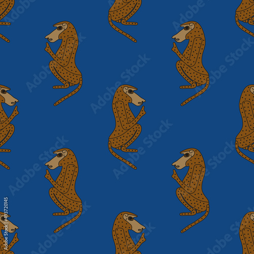 Seamless animal pattern with stylized seated male hamadryas baboon monkey or ape. Ancient Egyptian animal design. Embodiment of god Thoth. Brown silhouettes on blue background.