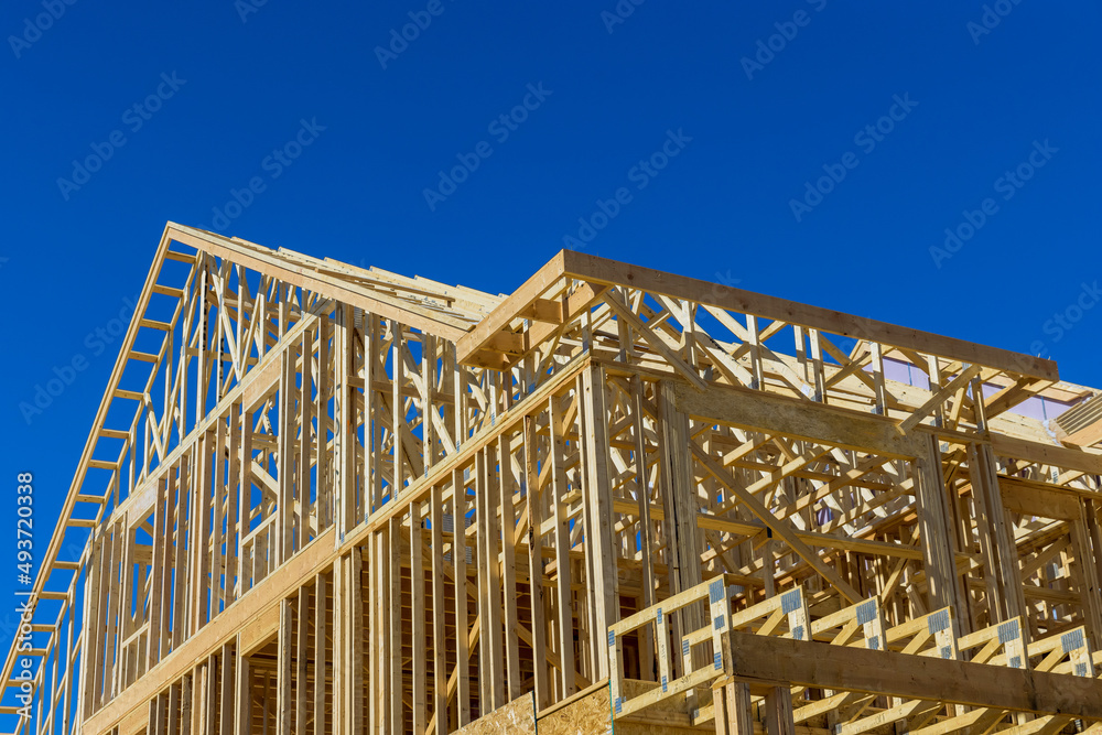 Obraz premium Wooden house roof residential construction home framing