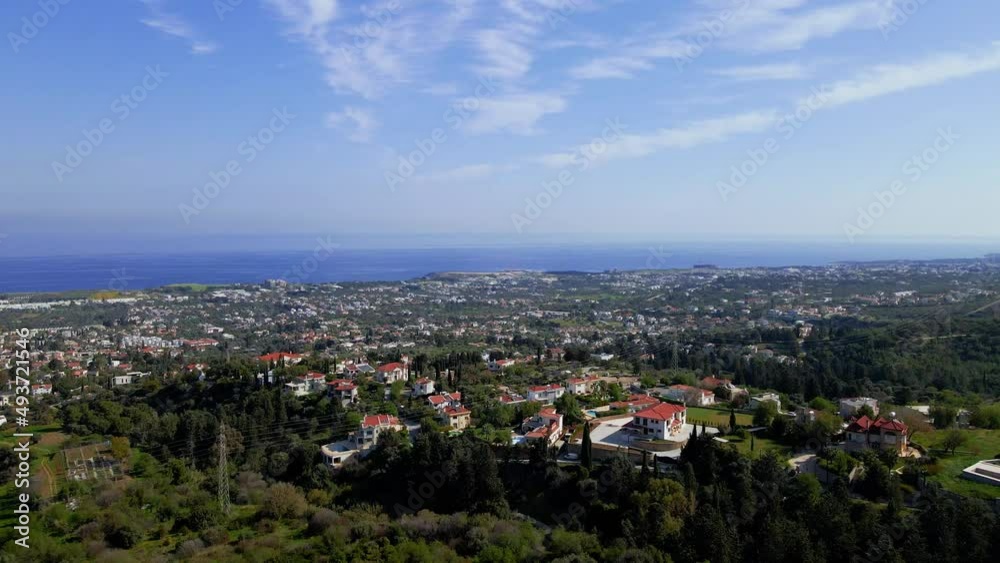 Aerial 4K view of beautiful Bellapais Village with Bellapais Monastery in Kyrenia, North Cyprus surrounded with an amazing green Mediterranean nature and picturesque landscapes in Cyprus. Aerial 4K view of beautiful Bellapais Village with Bellapais Monastery in Kyrenia, North Cyprus surrounded with an amazing green Mediterranean nature and picturesque landscapes in Cyprus.