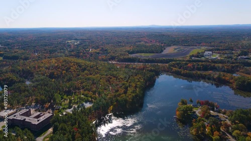 Merrimack River and Tyngsboro Bridge aerial view with fall foliage in downtown Tyngsborough, Massachusetts MA, USA. photo