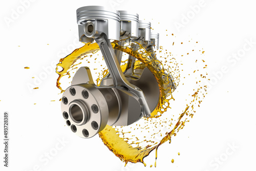 Car engine components with splashes of oil on white background. Crankshaft and pistons with oil. Lubricants for engine components.