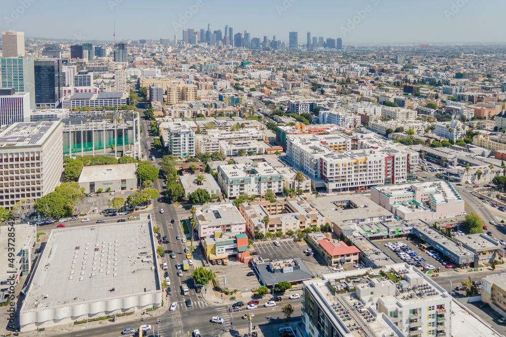 Los Angeles, CA, LA County, USA – March, 18 2022: Drone Aerial View of LA Korea town with Aroma Sports Center, Ralphs, and Downtown LA, CA
