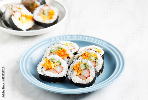 Korean Roll Gimbap (Kimbob or Kimbap) made from Steamed White Rice (Bap) and Various other Ingredients, Such As Kyuri, Carrot, Sausage, Crab Stick, or Kimchi and Wrapped with Seaweed Laver