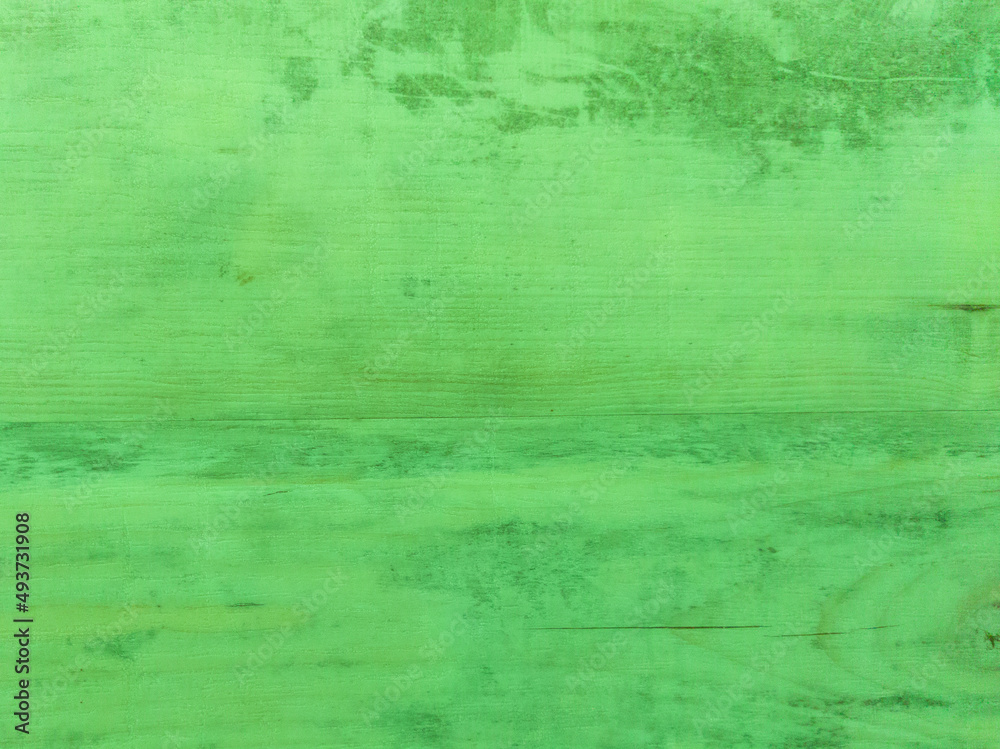 Obraz premium An old green wooden wall with a horizontal pattern. Vintage green background with wooden texture. 