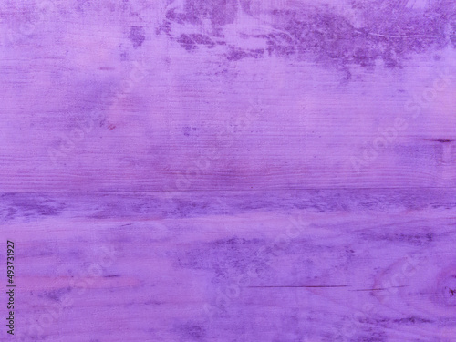An old purple wooden wall with a horizontal pattern. Vintage purple background with wooden texture. 