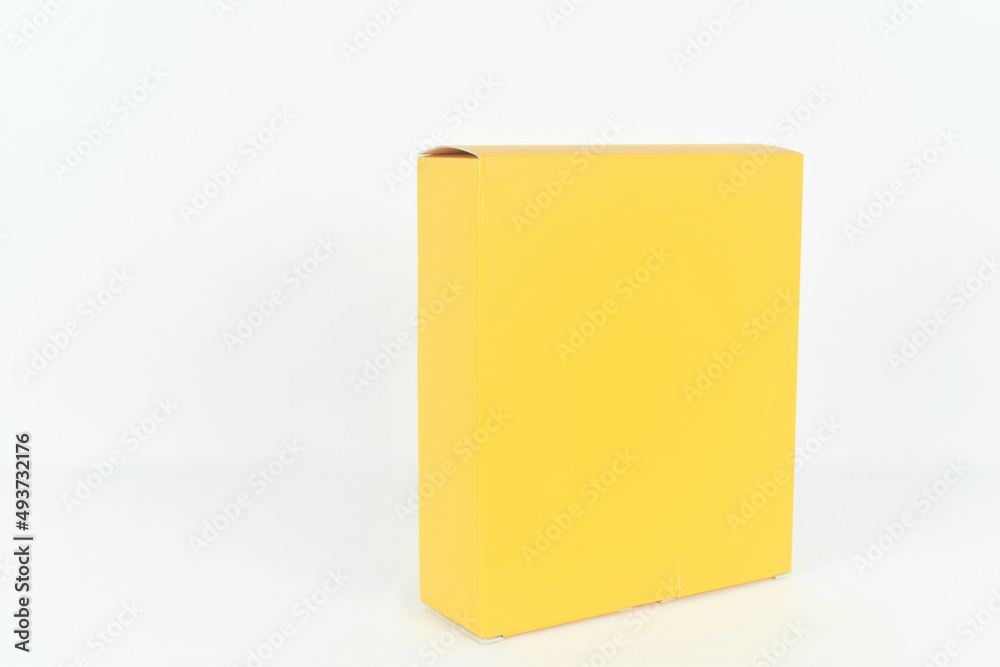 Yellow box tall shape product packaging in side view and front view for products design mockup on white background Yellow box tall shape product packaging in side view and front view for products design mockup on white background