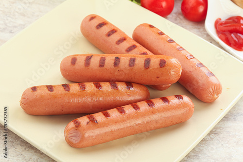 Grilled sausages with tomato sauce