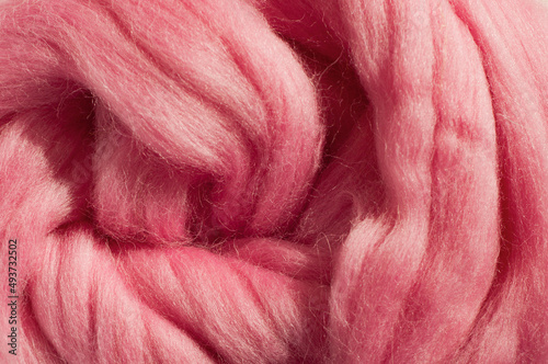 Pink wool for felting close-up photo