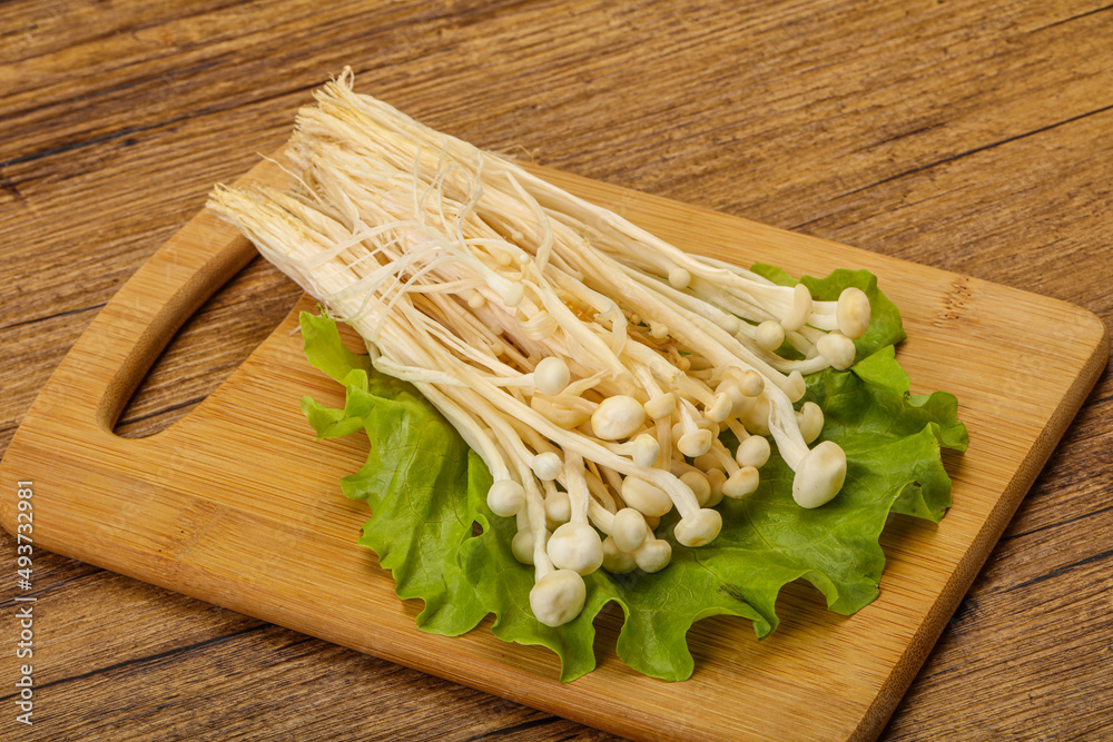 Raw Enoki mushrooms for cooking