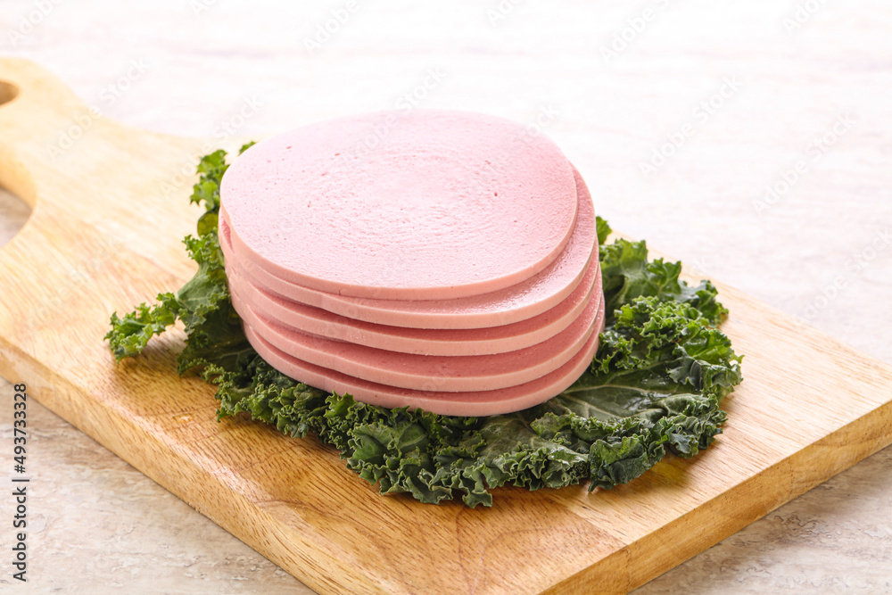 Slices pork sausage over board Slices pork sausage over board