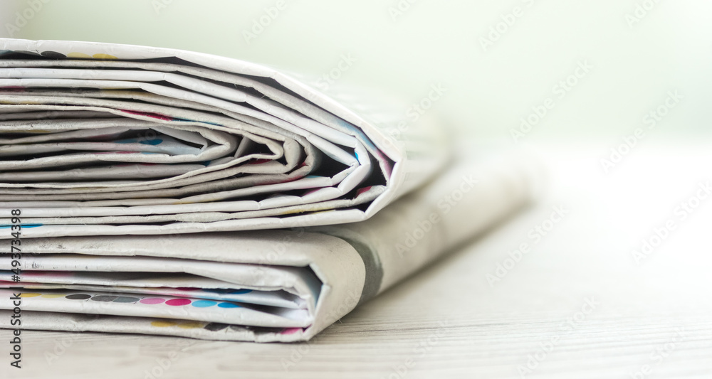 A stack of newspapers. Business news, finance. Latest information. Copy space A stack of newspapers. Business news, finance. Latest information. Copy space