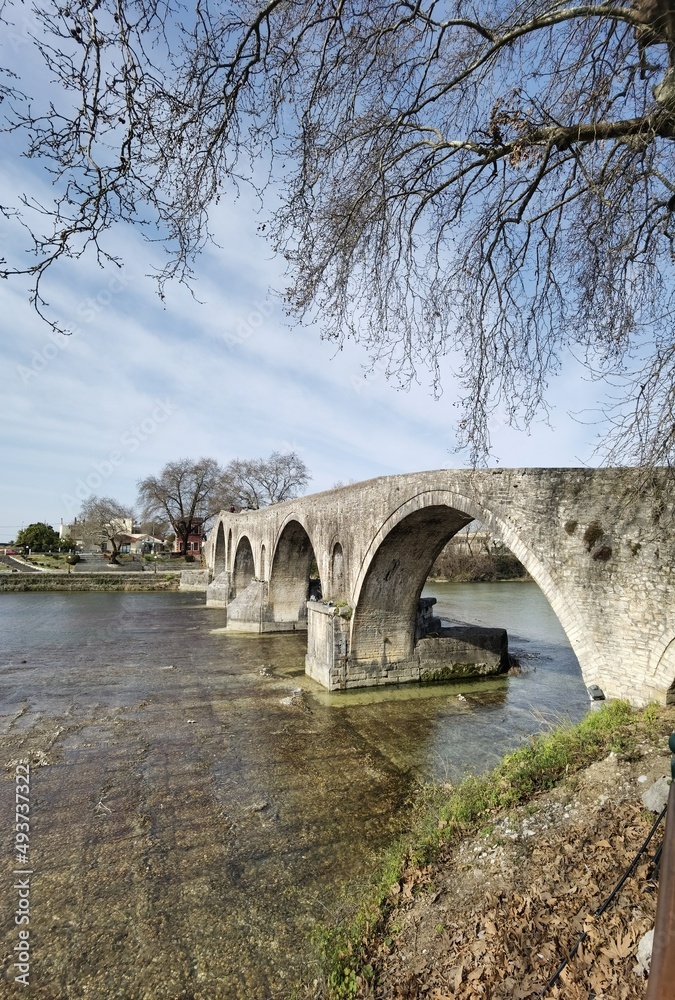 Fototapeta premium bridge arched in arta city on arahthos river in greece