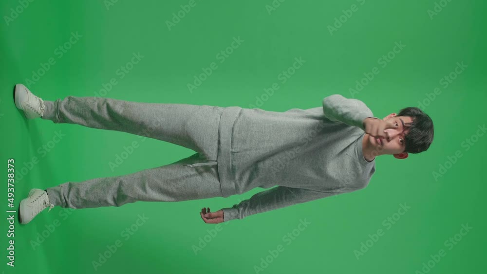 Full Body Of Angry Asian Man Scolding While Standing On Green Screen In The Studio
Full Body Of Angry Asian Man Scolding While Standing On Green Screen In The Studio