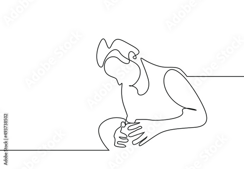 a rheumatic person with knee pain is sitting and holding his knees