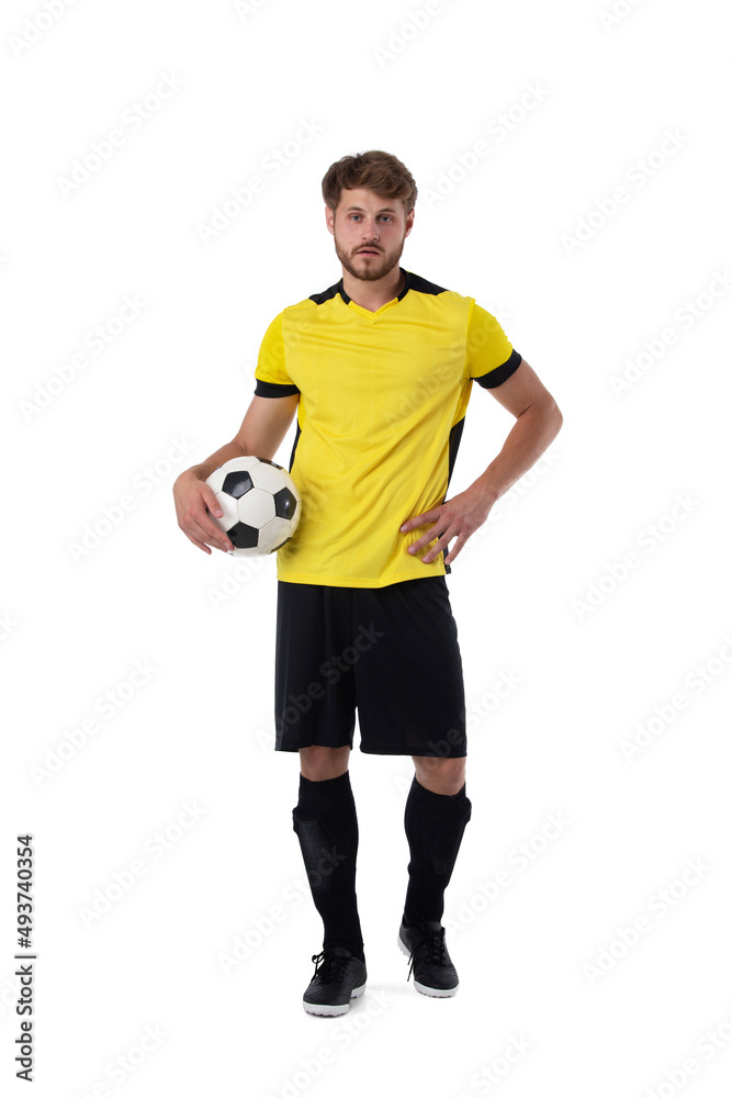 Soccer player with ball on white